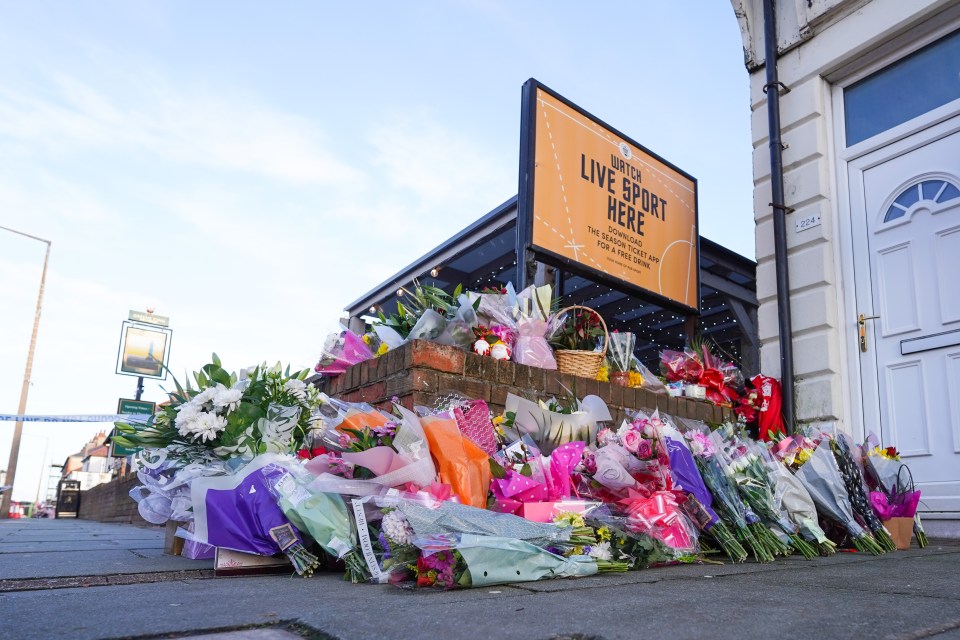 The area around the pub is now a sea of flowers and condolence cards