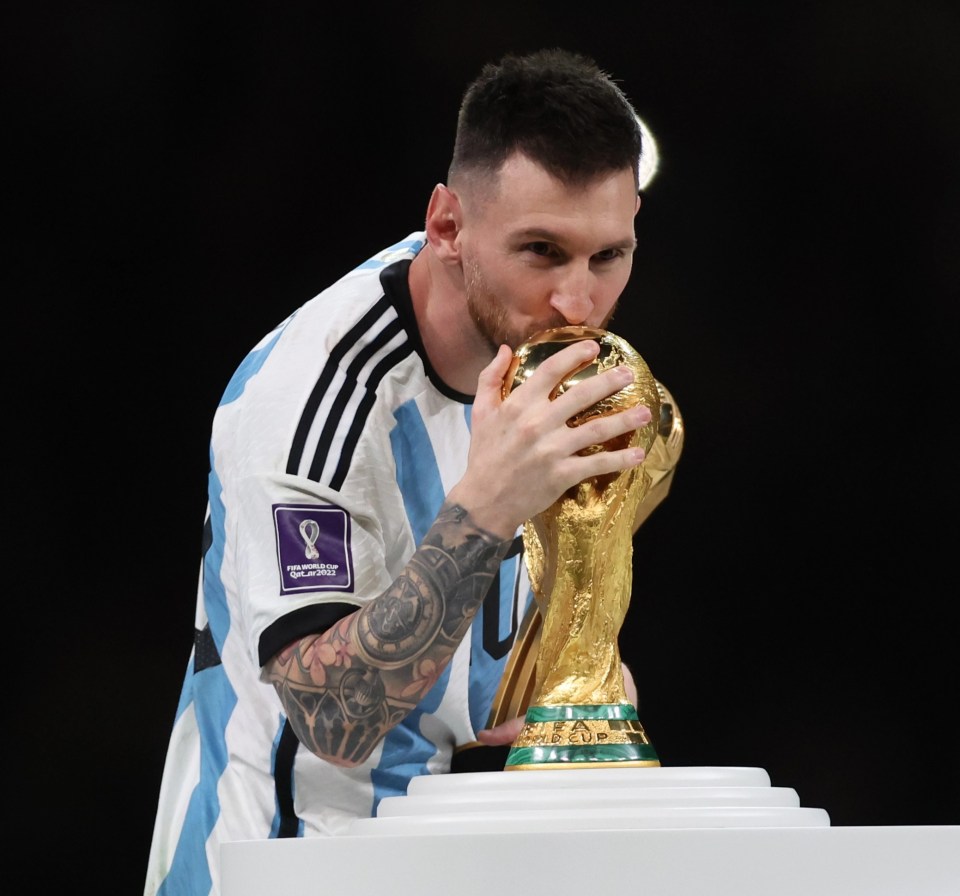 Messi gave the iconic trophy a kiss before getting his hands on it