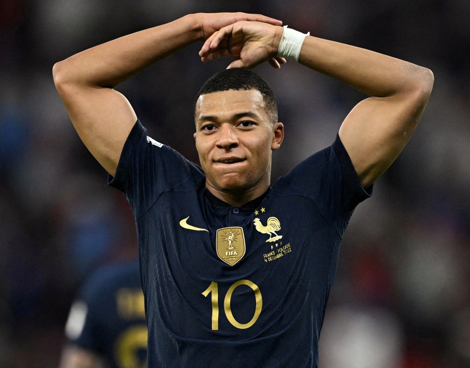 Kylian Mbappe celebrates his record-breaking double against Poland