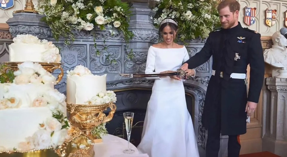 Harry and Meghan cut their wedding cake with a sword