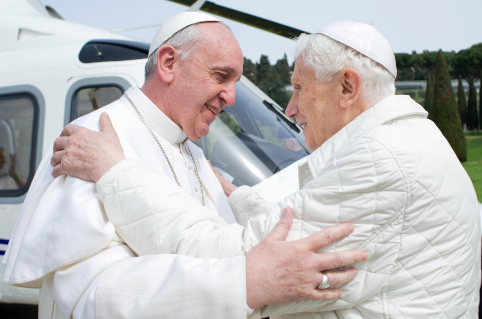 Pope Francis greeting Benedict in 2013 shortly after he retired