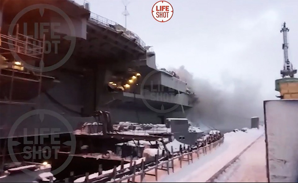 Flames and smoke leap from the 305m warship