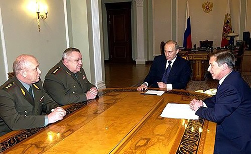 General Alexei Maslov, first from the left, meets Vladimir Putin in 2004