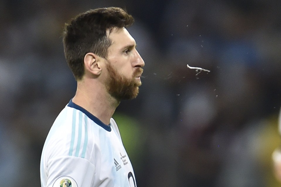 Lionel Messi spits during a game for Argentina