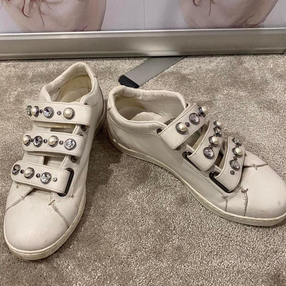 Katie has listed her Jimmy Choo trainers for sale