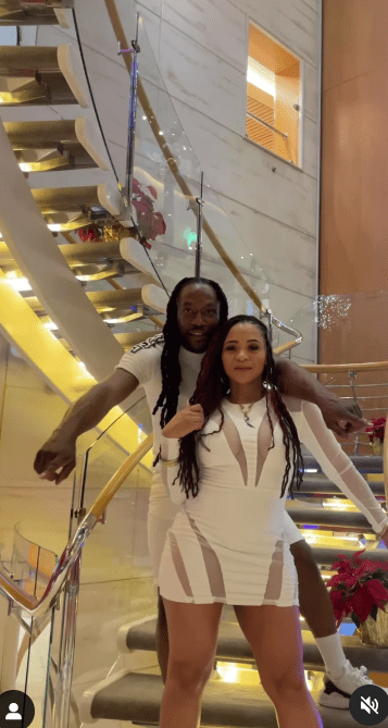 The pair posed on the boat dressed all in white