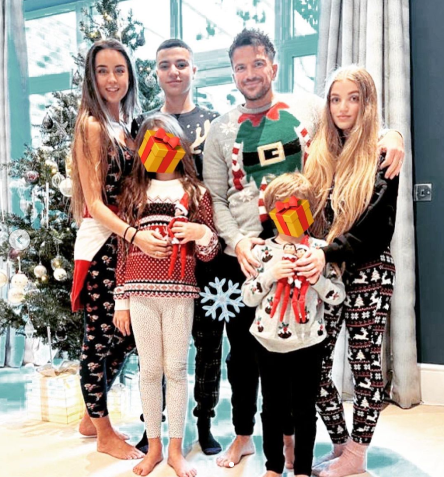 Emily, daughter Emilia, Junior, Peter, Theo and Princess posed beside the Christmas tree