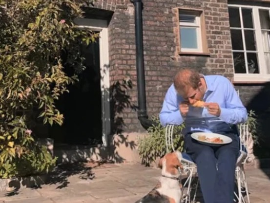 Harry tucks into food outside the Sussexes’ comfy cottage which was given to them for free