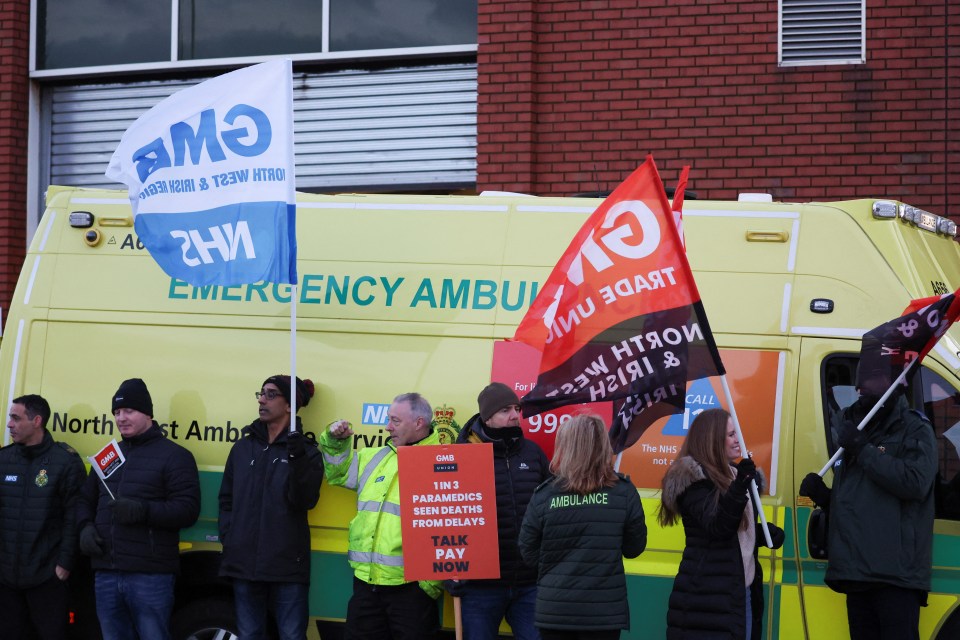 Ambulance workers take part in a strike, amid a dispute with the government over pay, outside Royal Liverpool University Hospital in Liverpool today