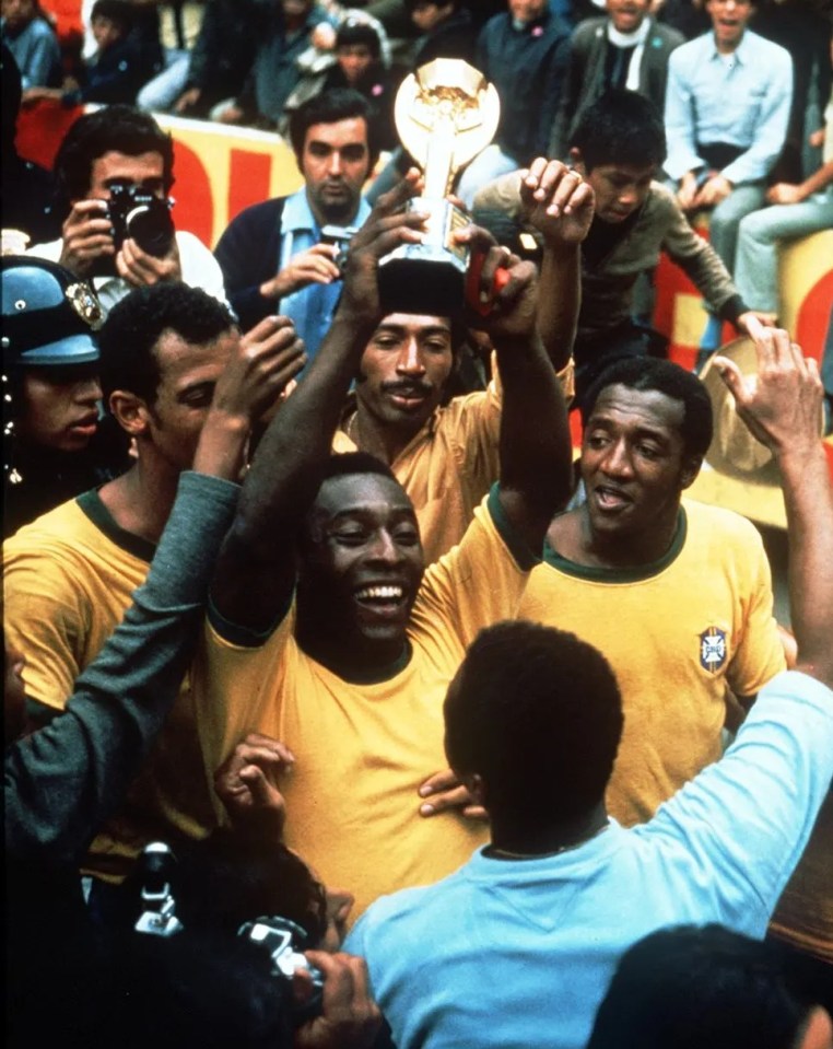 Pele holds up the Jules Rimet Trophy in 1970 - the third time he managed to lift the World Cup