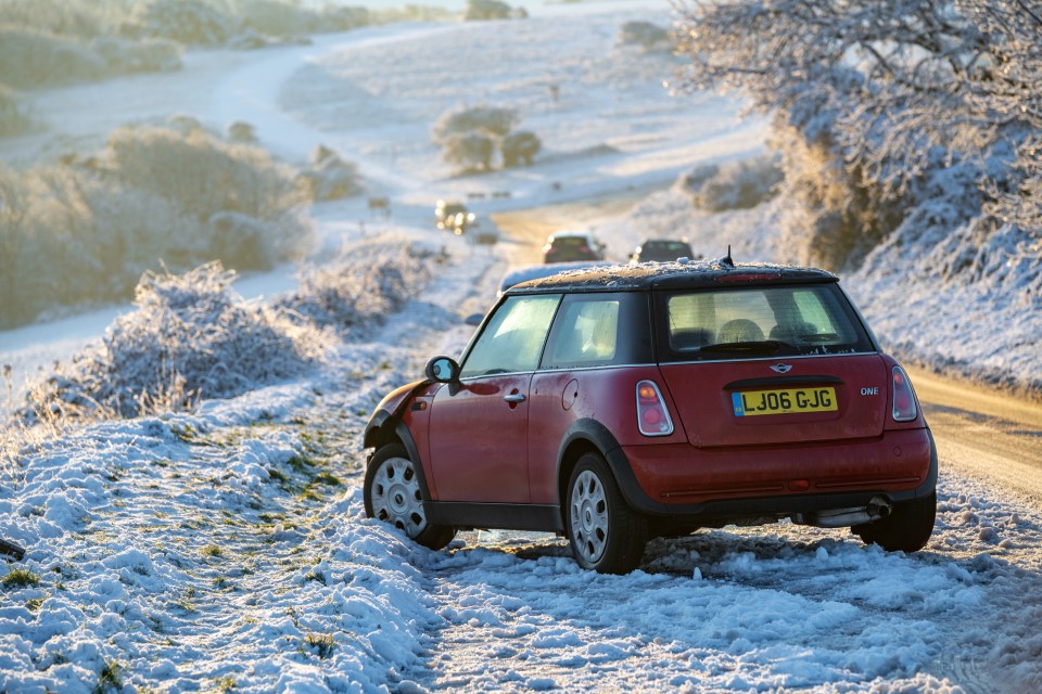 A damaged car with used airbags is left abandoned above Eastbourne near Beachy Head, East Sussex