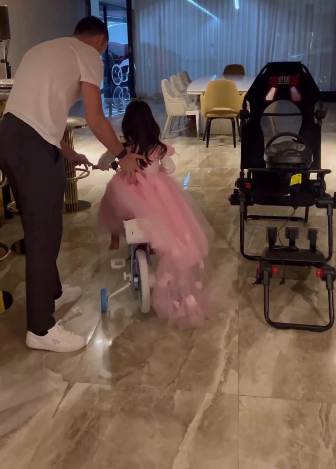 Ronaldo helped his daughter onto the stabilised bike