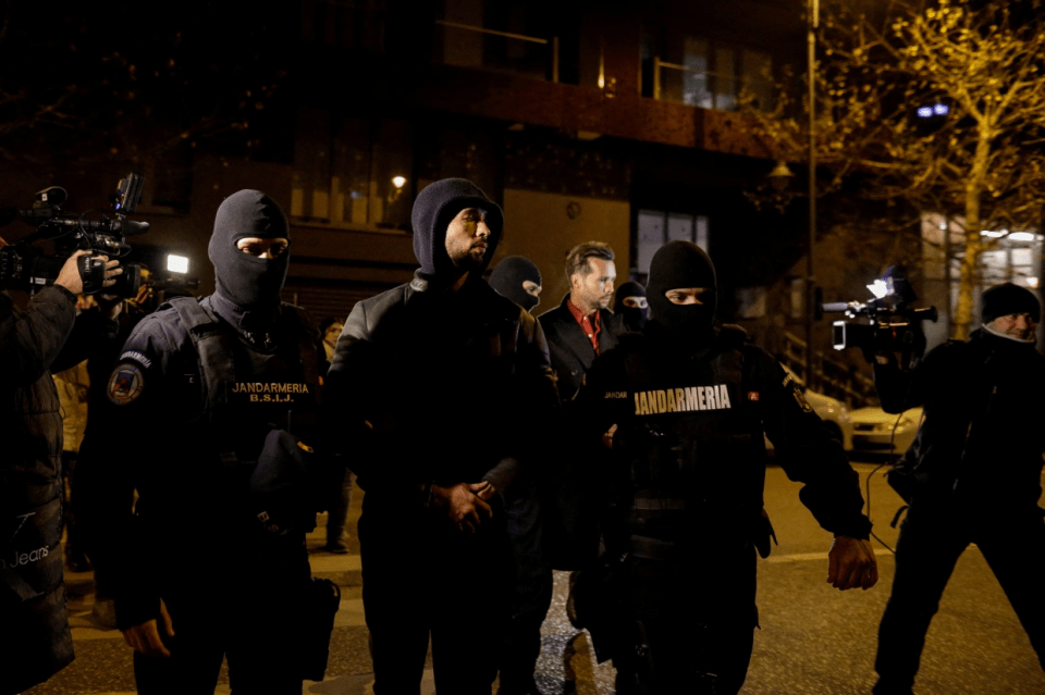 He and his brother were pictured being led away in handcuffs