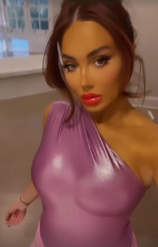 Frankie Sims stunned in a skintight purple one-shoulder top