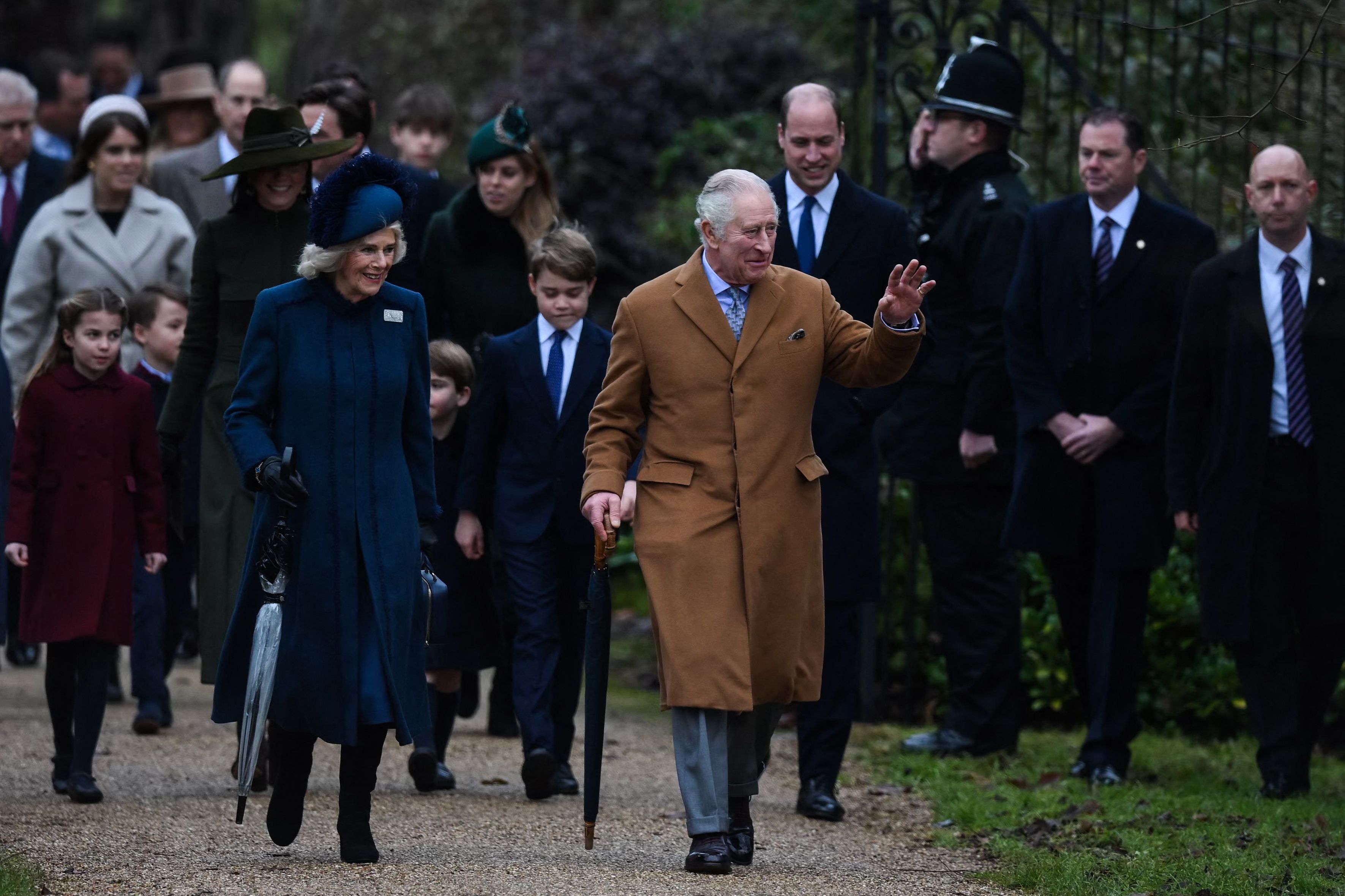 King Charles waved to crowds as he walked with Queen Consort Camilla at his side