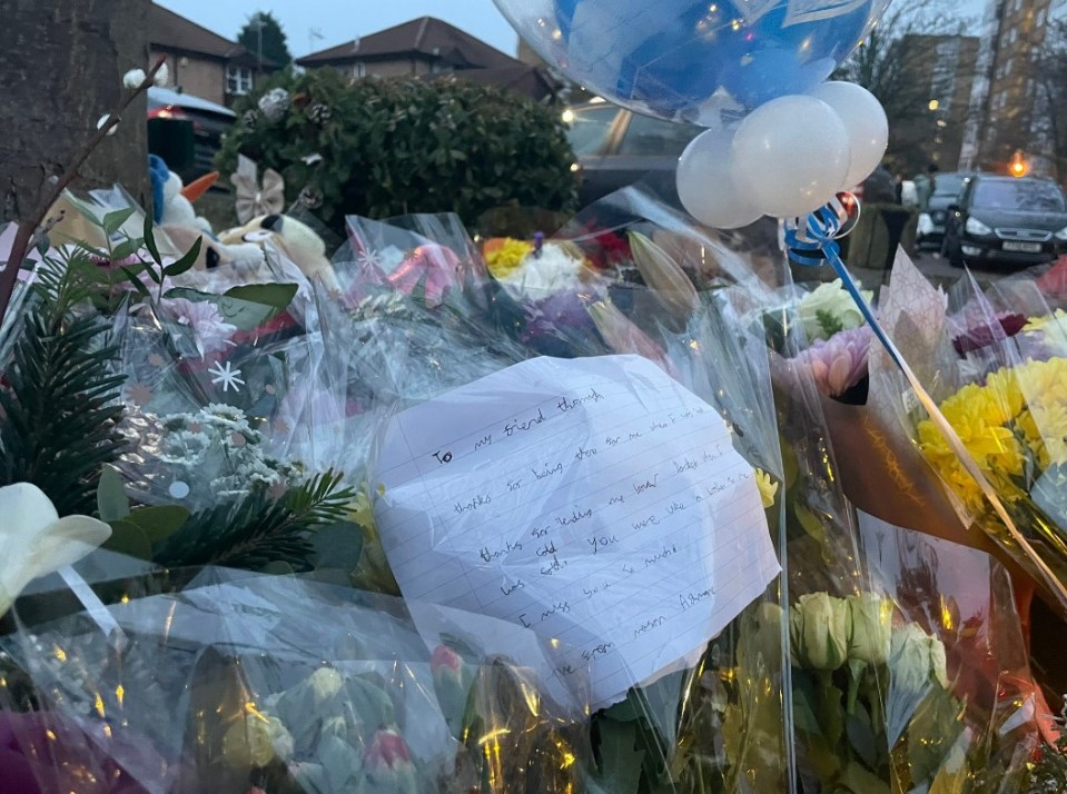 A floral tribute had also been left near the lake for a boy named Thomas