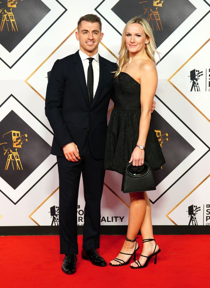 Gymnast Max Whitlock and wife Leah Hickton pose on the red carpet