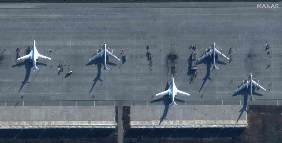 Satellite images show the Engels airbase in Russia with scorch marks and firefighting teams on the tarmac