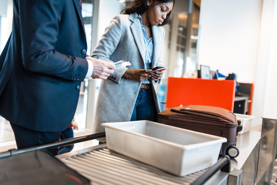 People waiting in line waiting for an airport security check