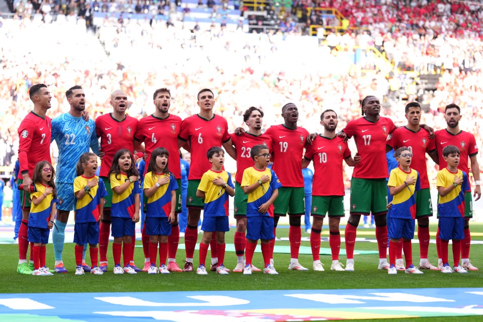 Portugal players singing their national anthem prior to kicking off their Euro 2024 group stage match against Turkey