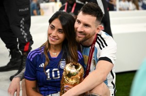 Lionel Messi and Antonela Roccuzzo celebrate after Argentina’s triumph at the 2022 World Cup