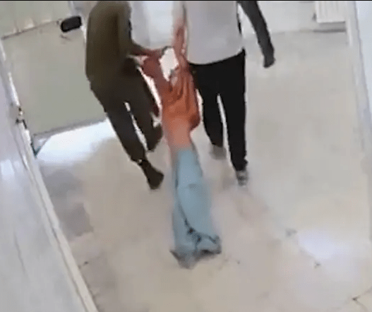 Leaked CCTV shows a man being dragged away by guards in Evin