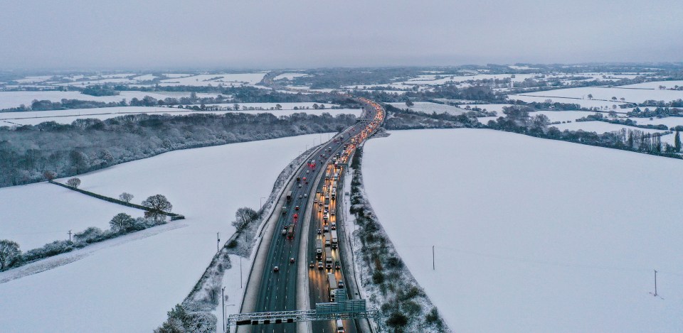 A traffic jam tails back as people are forced to drive rather than ride trains