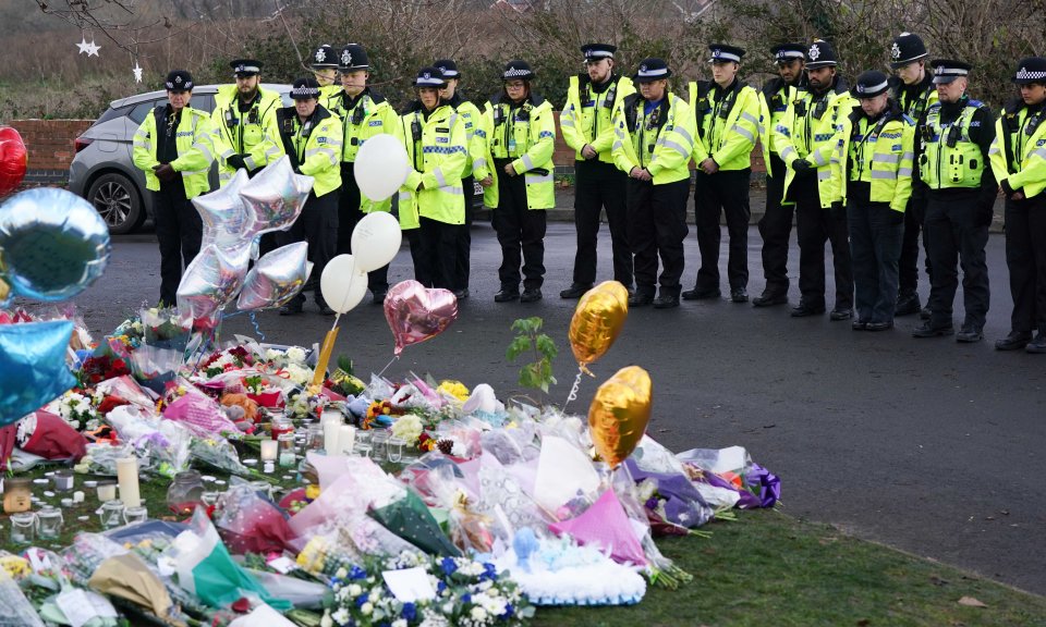 West Midlands police lays flowers near to the scene