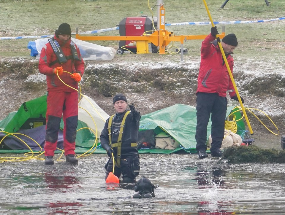 Police divers searching the frozen lake