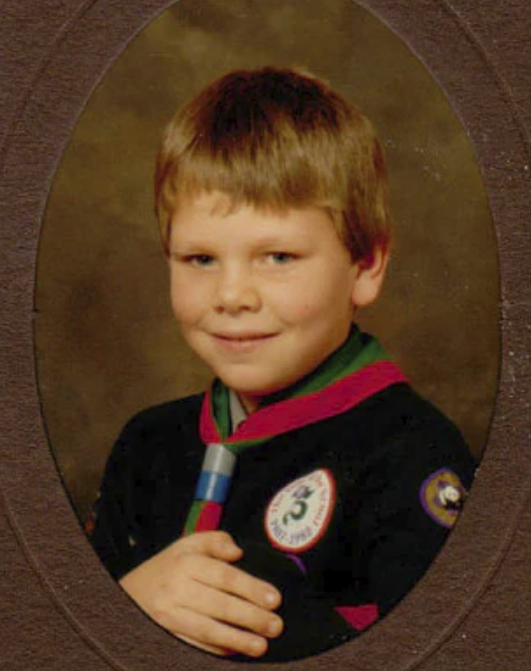 Tom as a lad in his Cub uniform