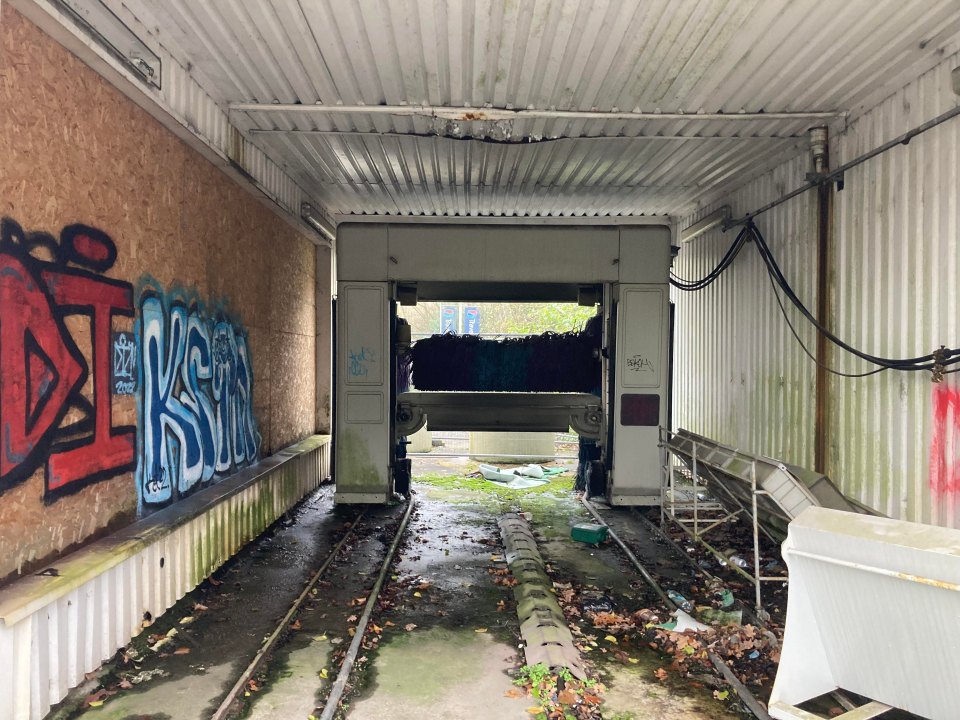 An abandoned car wash remains