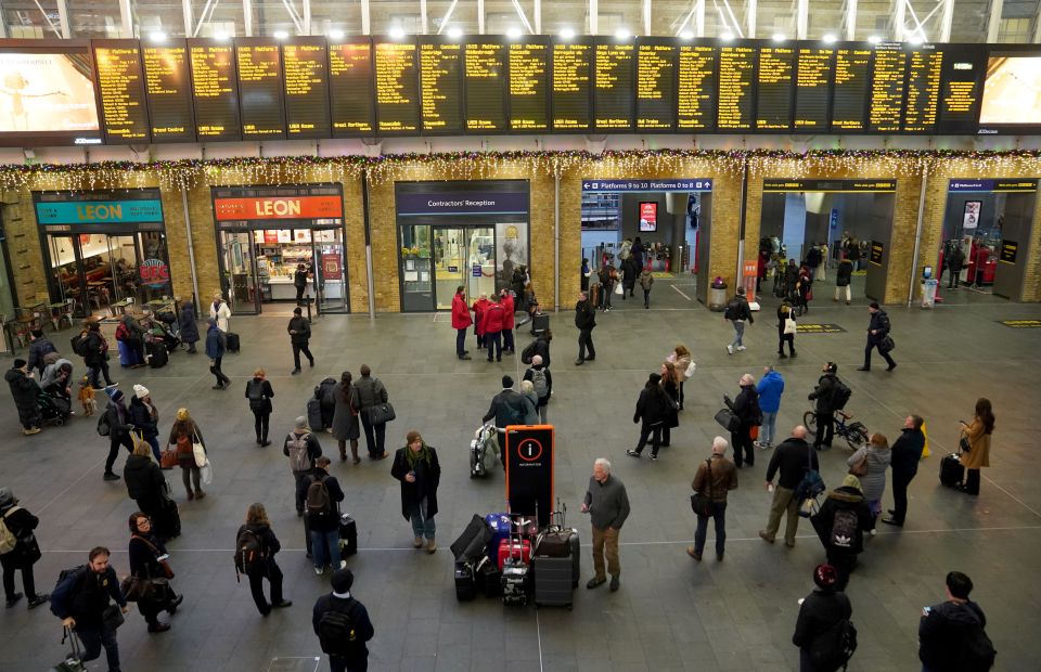 Commuters at King’s Cross station as travel chaos struck across large parts of the UK