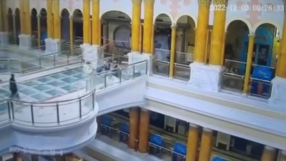 A worker fell through a gap in a glass bridge in a Shanghai shopping centre after workers failed to fill the gap before taking a break