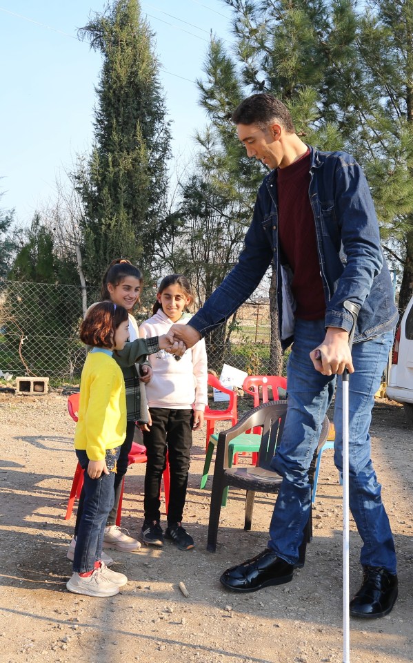 At 8ft 3in, he towers over children in his village in eastern Turkey