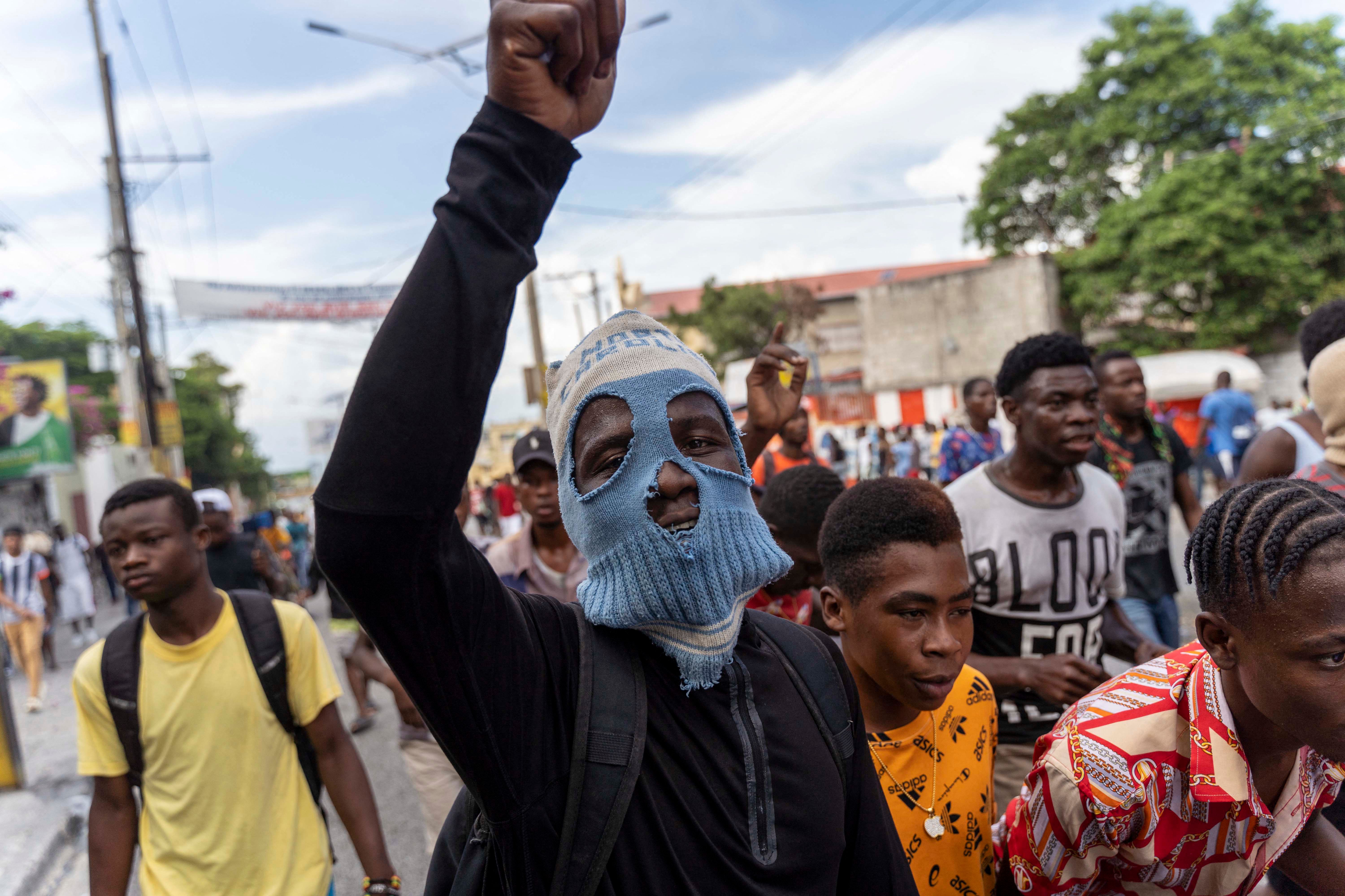 People protest during a demonstration against Haitian Prime Minister Ariel Henry and the United Nations in October