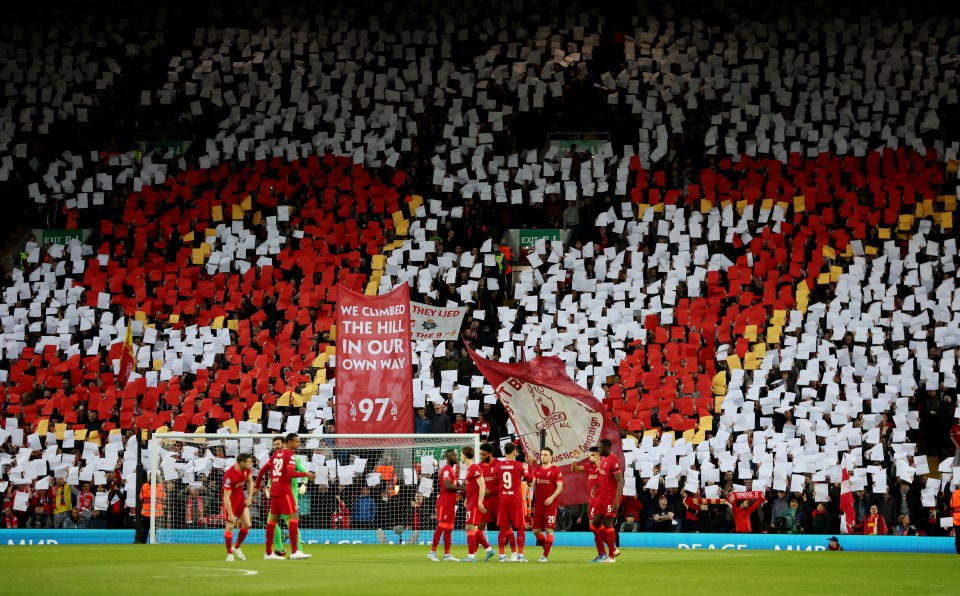 Liverpool fans hold up signs for the 97 victims of the Hillsborough disaster in 2022