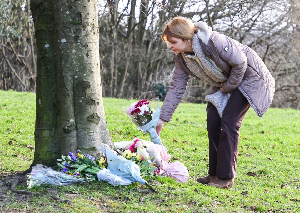 Mourners leave tributes near the scene of the tragedy