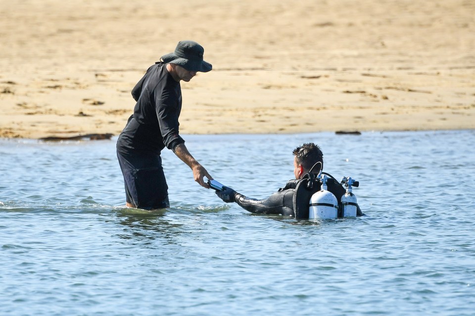 Police divers find debris as they search the Broadwater