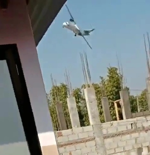 And then the plane appears to lose control as it dips behind a building