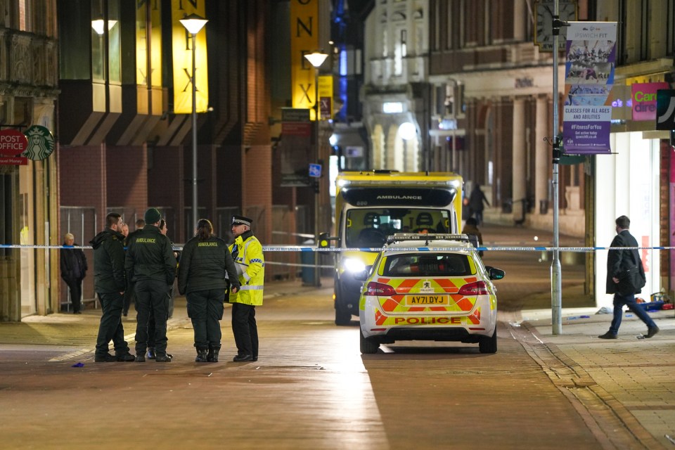 Police at the scene after a man was stabbed to death in the town centre of Ipswich, Suffolk