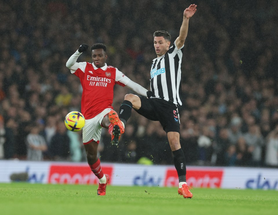 Eddie Nketiah and Newcastle defender Fabian Schar tussle for the ball