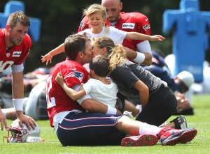  Tom Brady getting a group hug from his daughter Vivian, son Benjamin and his now, ex-wife, Gisele Bündchen