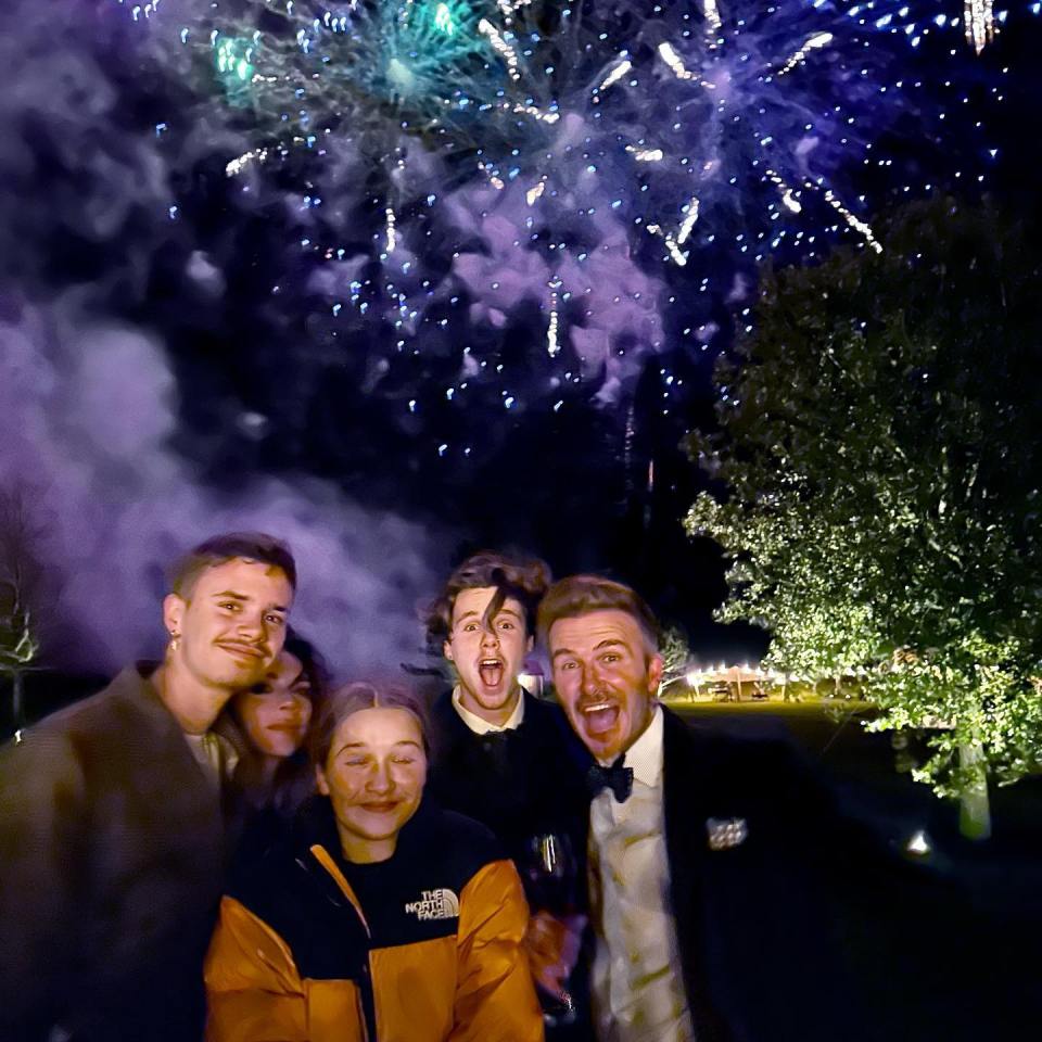 David and Victoria Beckham posed for a snap with their kids underneath the firework display on their estate