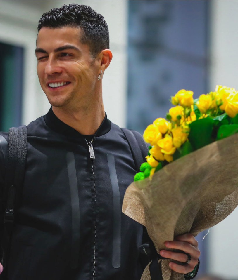 Ronaldo gave fans a wink after touching down