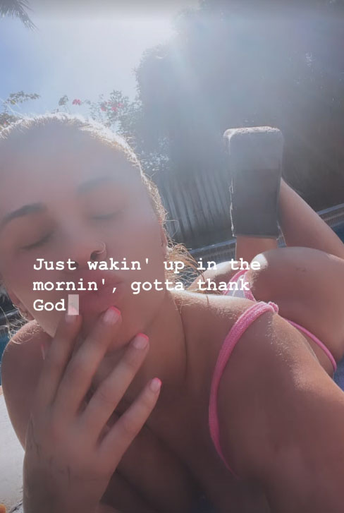 Paige VanZant stunned in a pink bikini as she relaxed by the pool