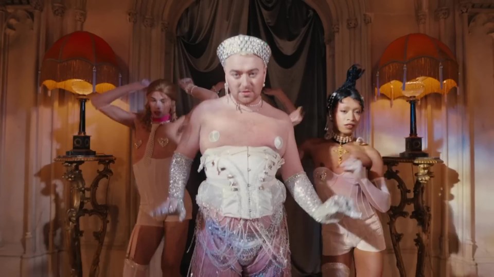 Sam strips down to a corset and nipple pasties in their new music video