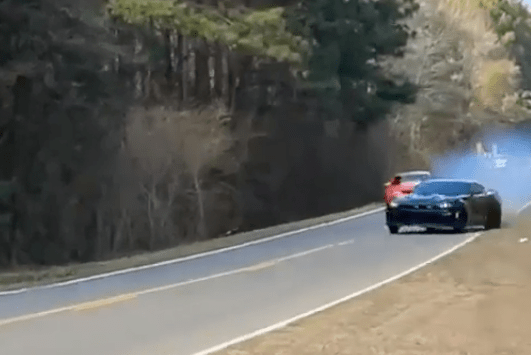 Two muscle cars were street racing illegally before one car lost control