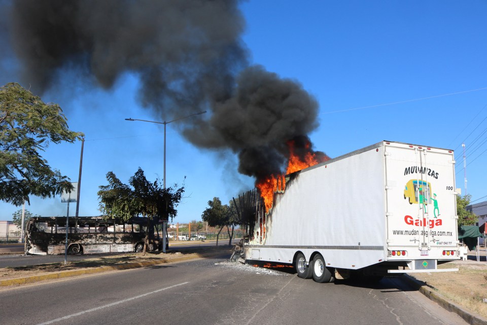 Cartel fighters torched vehicles and set up roadblocks