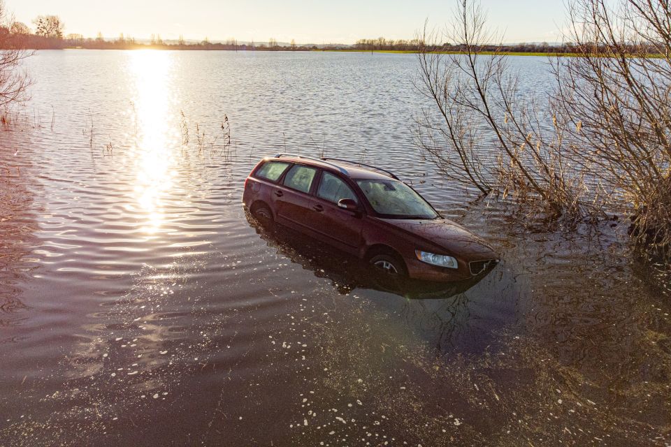 A car was stranded in the flooding near Muchelney, Somerset during recent heavy rain