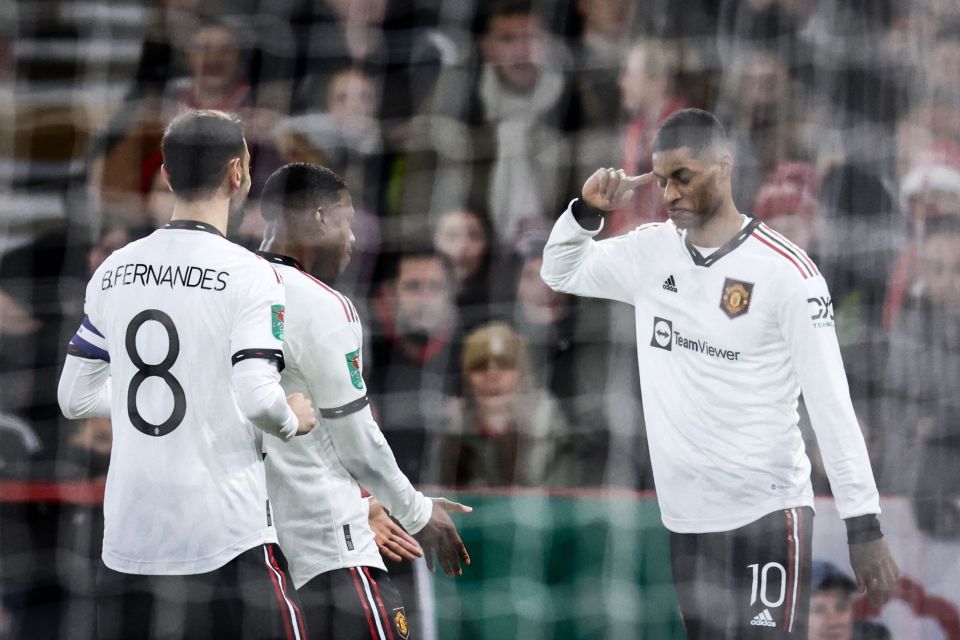 Manchester United’s Marcus Rashford (R) celebrates after his strike at Forest